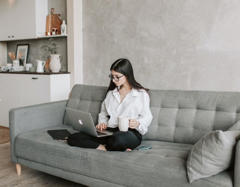 woman-sitting-on-sofa-while-working-at-home-4050295